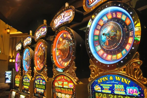 Live dealer managing Teen Patti table with three-card layout visible on camera